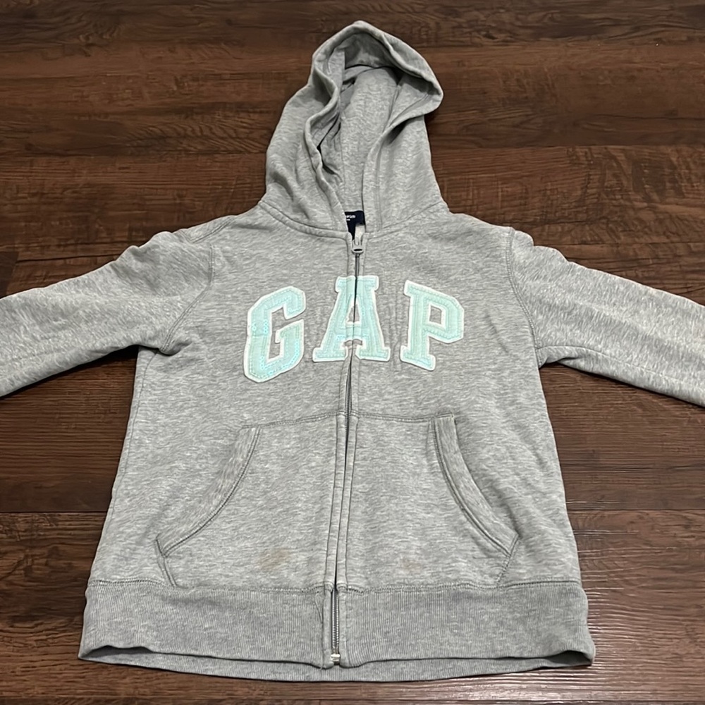 Grey zip up jacket, gap glitter logo.